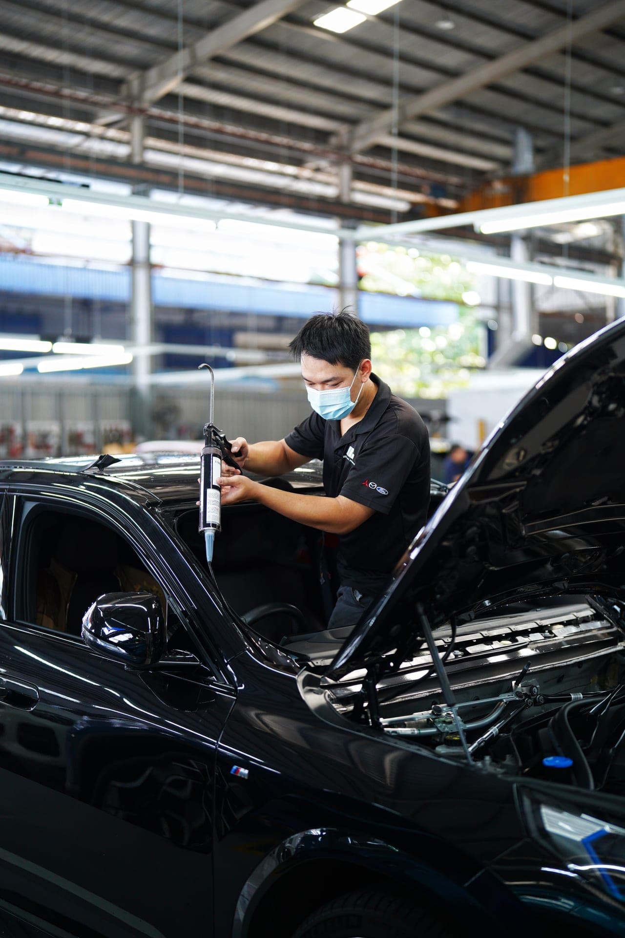 Technician performing vehicle diagnostics