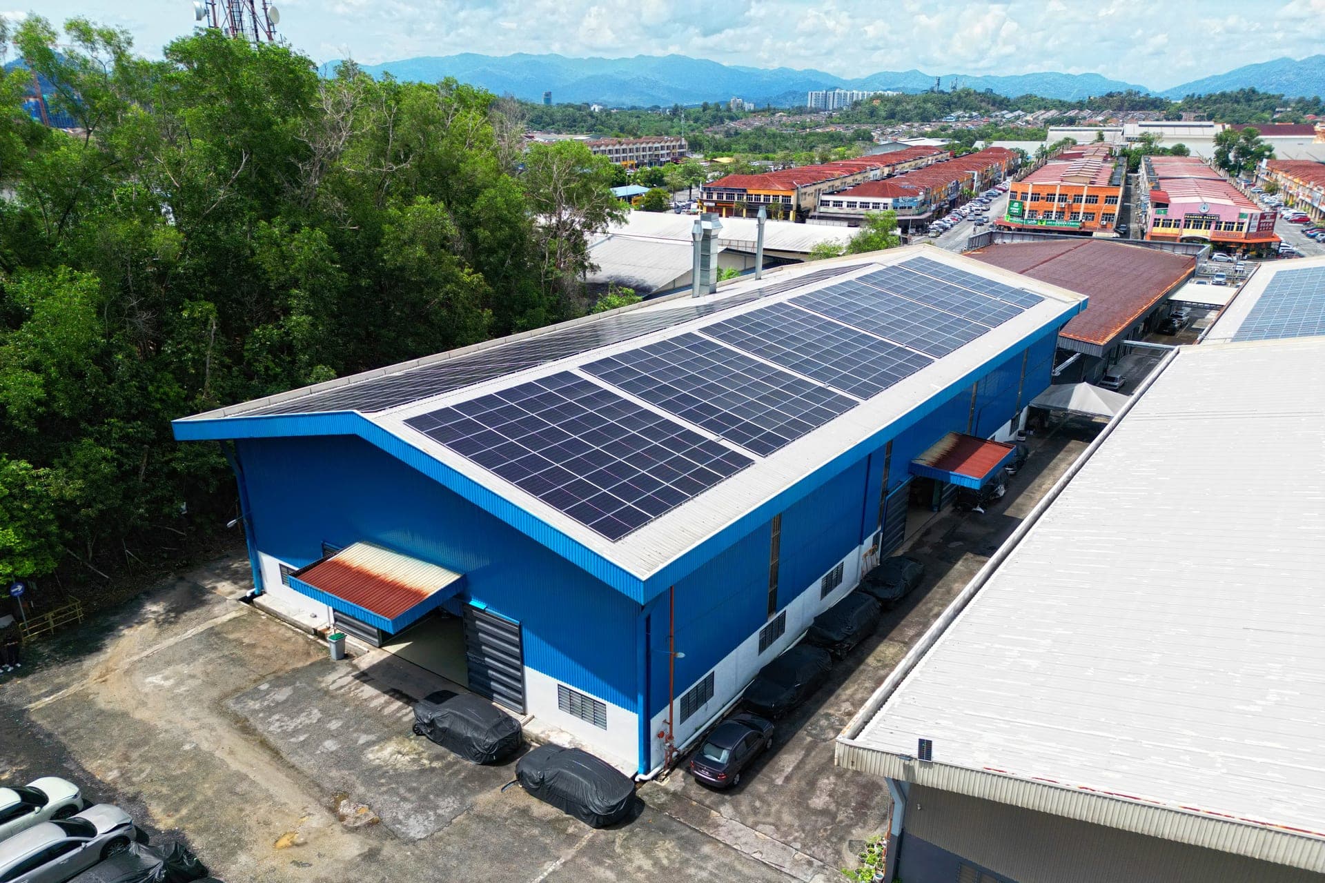 Seremban branch aerial — solar panels on blue building